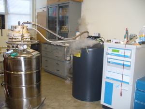 liquid nitrogen being loaded into a helium container.